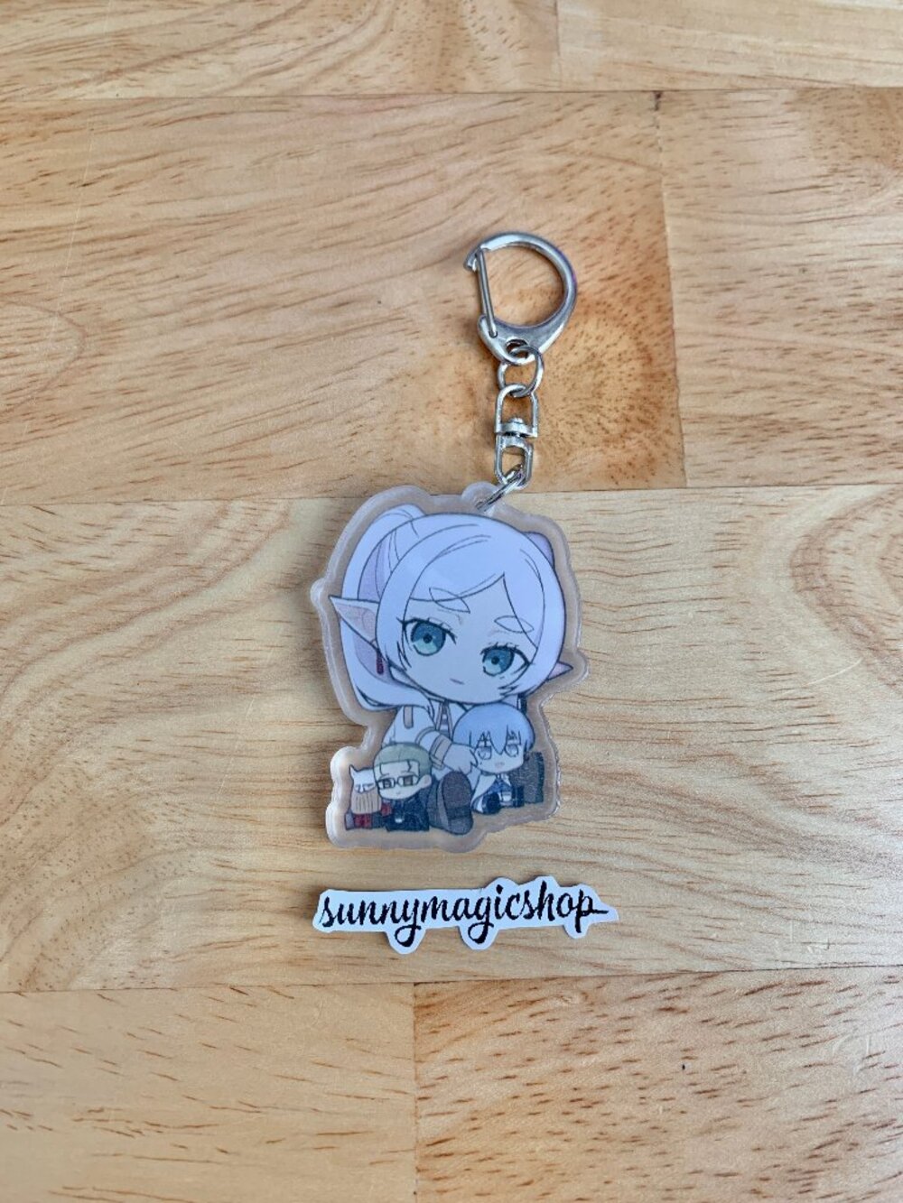 Frieren Beyond Journey's End Anime Acrylic Keychain White Hair Elf Sitting Holdi